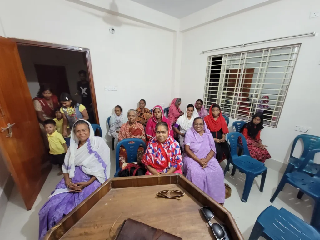 Missionary team sharing the Gospel in a village Gospel outreach event with local community Discipleship training program for new believers Volunteers praying for mission work abroad Children participating in Bible study on mission trip Outdoor Jesus Film screening for villagers Team providing meals and support during outreach Local church packed for Gospel presentation Missionaries teaching faith to new believers Supporters giving generously to Christian missions Prayer meeting for global mission trips Team walking through village during outreach Sharing the Gospel with Hindu villagers in a temple Community gathering for evangelism event Missionary teaching Scripture during small group Donors helping fund international mission programs Team preparing materials for Gospel outreach Local children learning about Jesus during mission Volunteers praying over new believers living word foundation Mission trip team serving the community with love