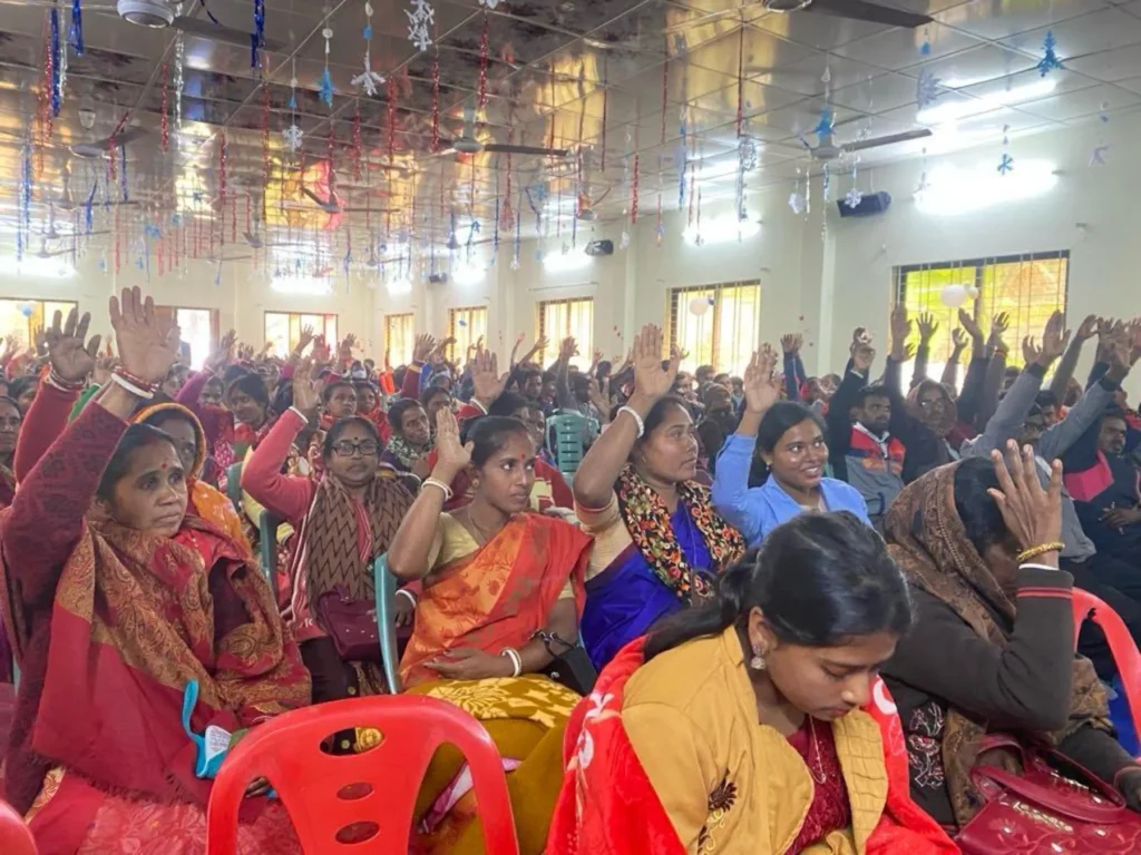 Missionary team sharing the Gospel in a village Gospel outreach event with local community Discipleship training program for new believers Volunteers praying for mission work abroad Children participating in Bible study on mission trip Outdoor Jesus Film screening for villagers Team providing meals and support during outreach Local church packed for Gospel presentation Missionaries teaching faith to new believers Supporters giving generously to Christian missions Prayer meeting for global mission trips Team walking through village during outreach Sharing the Gospel with Hindu villagers in a temple Community gathering for evangelism event Missionary teaching Scripture during small group Donors helping fund international mission programs Team preparing materials for Gospel outreach Local children learning about Jesus during mission Volunteers praying over new believers Mission trip team serving the community with love